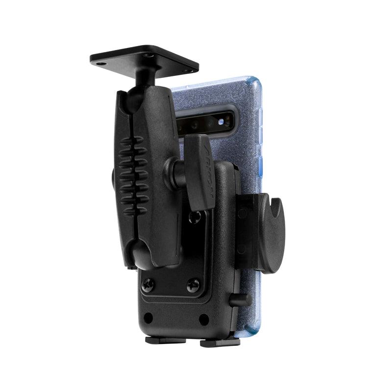 A Drill-Base Mega Grip™ Phone Mount is attached to a smartphone in a blue case. This black mount features an adjustable arm, locking joint, clamp, and 4-hole AMPS base for secure installation on vehicles or flat surfaces.