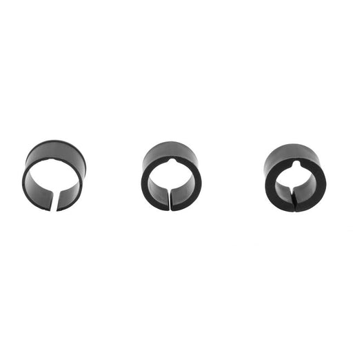 Three black circular clips with open slits, evenly spaced on a white background—the Handlebar Spacer Kit is perfect for use as handlebar adapter rings to customize your bike setup.