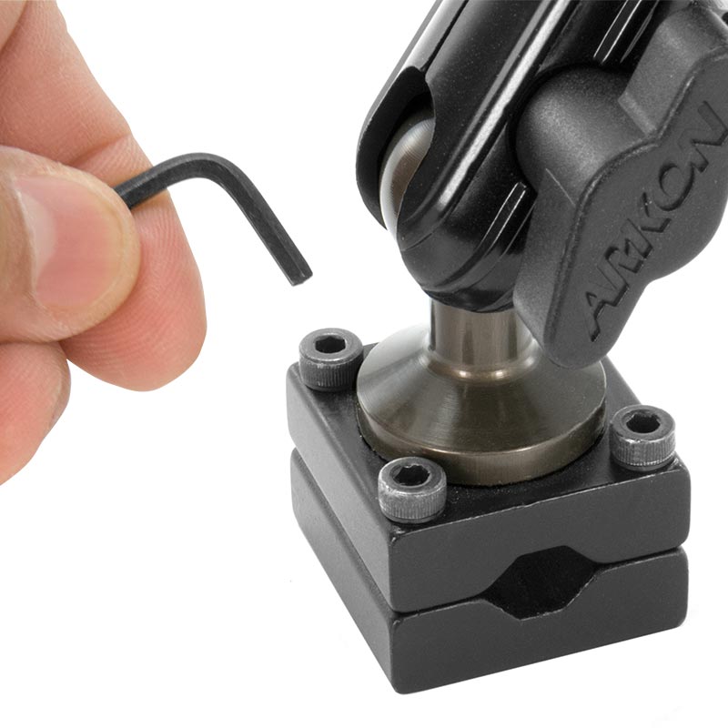 A hand uses an L-shaped hex key beside the black Heavy-Duty Headrest Mounting Pedestal with Multi-Angle 8 Arm, showing how to tighten or loosen screws on this universal tablet holder.