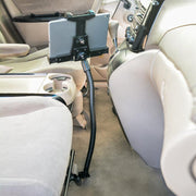 A LockVise™ Locking Seat Rail Tablet Mount with 22 Gooseneck is installed between the front seats, positioning the screen toward the passenger. The light-colored interior includes fabric seats and cup holders for added convenience.