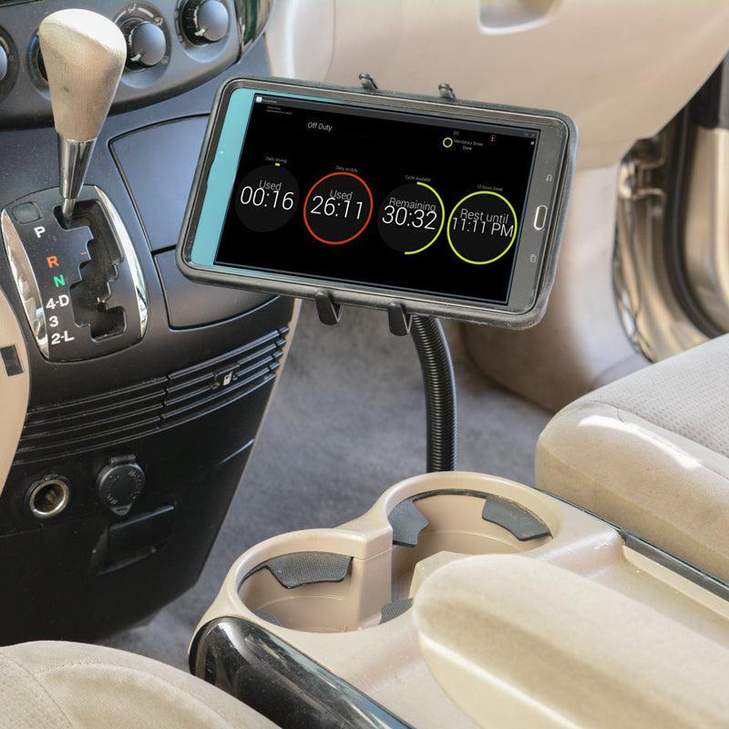 An iPad is secured with the Heavy-Duty Truck Seat Rail Slim-Grip® Ultra Mount in a car, displaying a timing app with three countdown timers. The gear shift, cup holders, and beige car seats are also visible in the foreground.