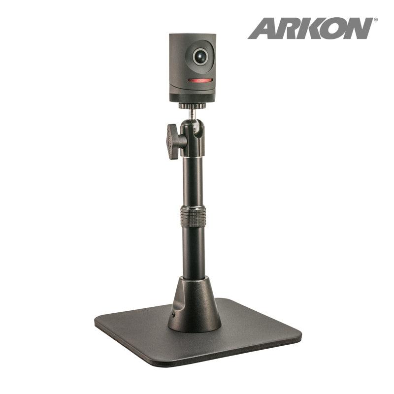 A compact black Mevo camera sits on the Height-Adjustable Camera Desk Stand (7.5 to 9.75 inches tall), shown with a square base on a white background. ARKON branding appears in the top right corner, ideal for live streaming setups.