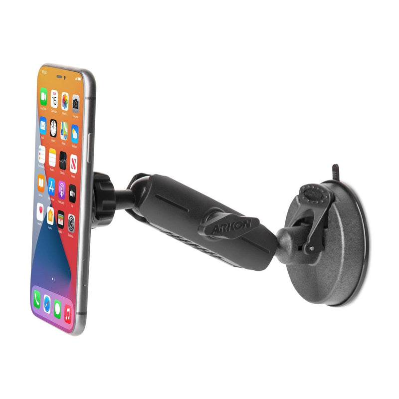 A smartphone is secured to a surface using the Magnetic Holder with Suction Mount, featuring a black adjustable design. The phone’s screen is on, showing various app icons.