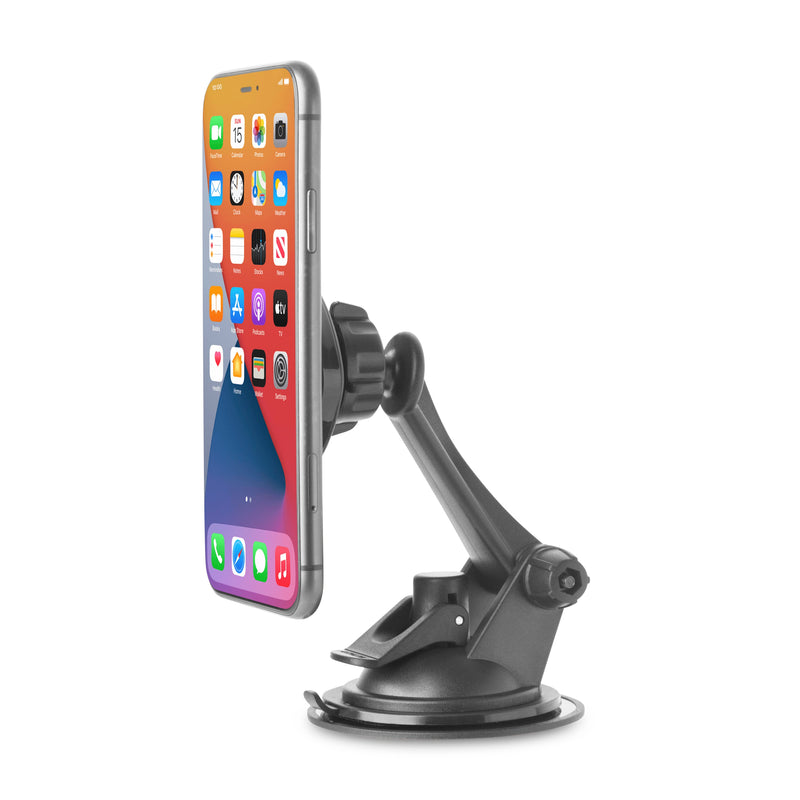 A Magnetic Phone Holder Mount for iPhone, Galaxy, and Note is vertically attached to a car dashboard with a black adjustable magnetic design and suction cup base, holding a smartphone showing colorful app icons on its home screen.