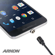 A smartphone with a Magnetic USB to USB Type-C Charge Cable partially connected to its charging port, app icons visible on the screen. The ARKON logo appears in the bottom left corner.