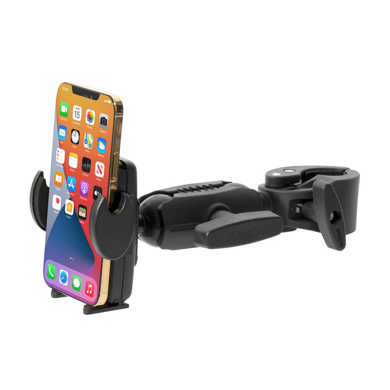 A smartphone is secured in the black Mega Grip Phone Holder with Clamp Mount, ideal for attaching to handlebars or desks. The phones screen displays various colorful app icons.