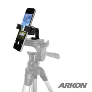 The Mobile Grip 2 Tripod Adapter with Phone Holder secures a phone to a tripod with its adjustable universal holder featuring the ARKON logo. The phone screen shows a landscape photo.