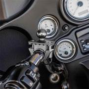 Close-up of the Motorcycle or Bicycle Handlebar Mount - 25mm (1 inch) Ball Compatible, attached near control switches and dashboard gauges—perfect for securing a phone holder.