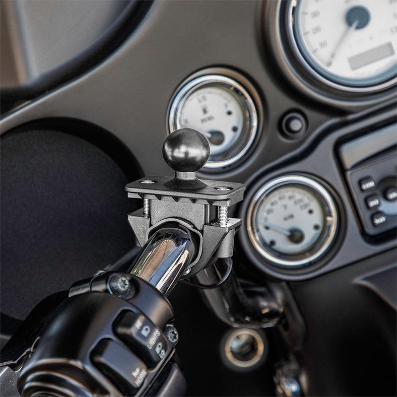 Close-up of the Motorcycle or Bicycle Handlebar Mount - 25mm (1 inch) Ball Compatible, attached near control switches and dashboard gauges—perfect for securing a phone holder.