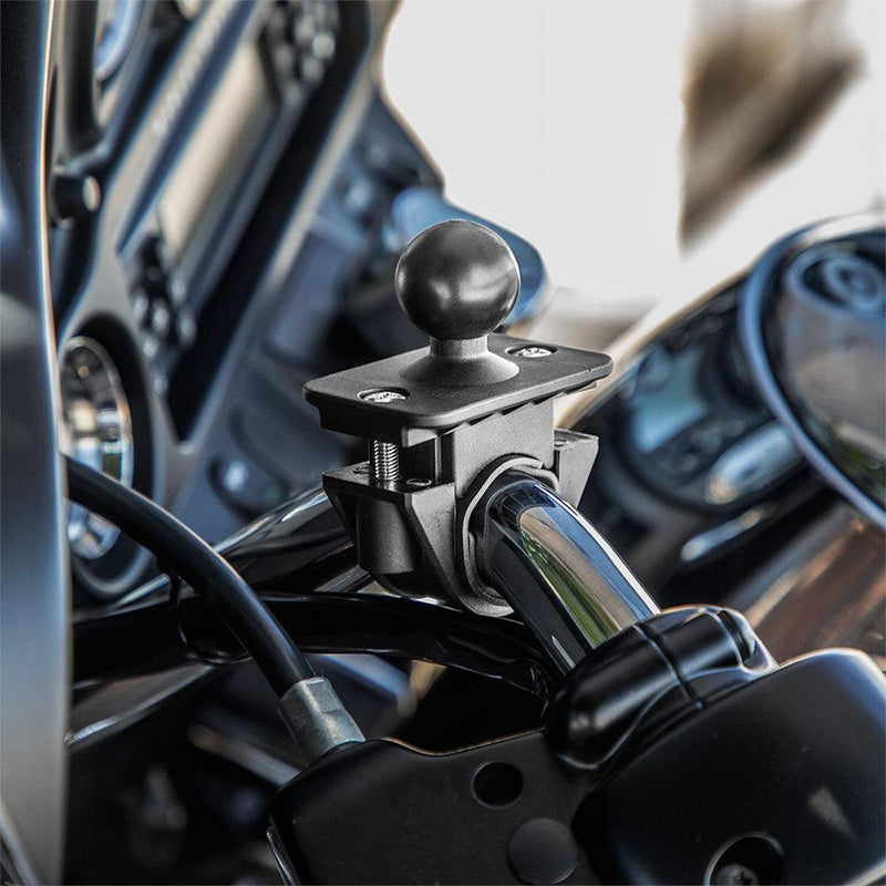 A Motorcycle or Bicycle Handlebar Mount - 25mm (1 inch) Ball Compatible is securely attached to the chrome motorcycle handlebar, ready to hold devices or accessories. The dashboard can be seen in the background.