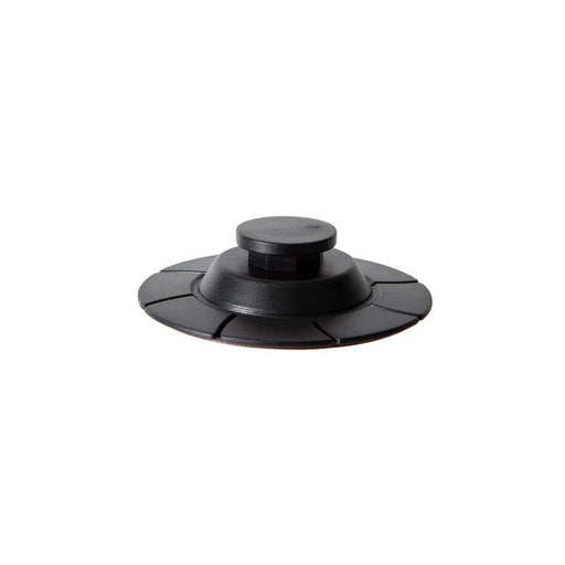 A black OCTO™ Series Adhesive Base to Octagon Button Adapter, circular and ridged with a raised center and VHB adhesive base, is shown on a white background.