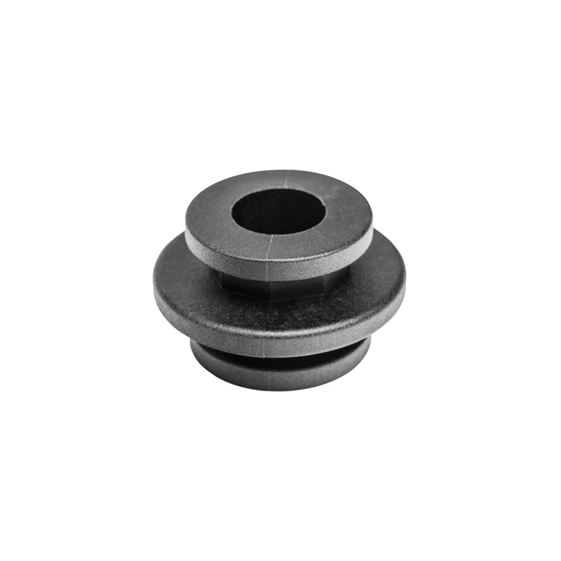 The OCTO™ Series Composite Double Button is a black, round pulley with a central hole and two flanges, designed for octagon pattern components, shown on a white background.