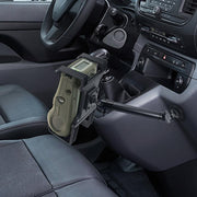 A Portable Mobile Printer Car & Truck Mount with Drill Base for Zebra, Epson, and Brother printers is installed on the dashboard above the center console and gear shift, near the drivers seat in a vehicle interior.