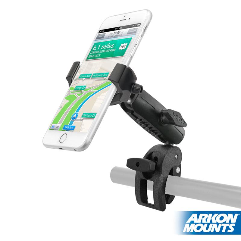 A smartphone is mounted on the RoadVise® Ultra Phone and Tablet Holder with Clamp Mount and Security Knob, secured to a metal bar, displaying a GPS navigation screen. The Arkon Mounts logo appears in the bottom right corner.