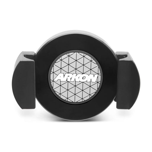 The RoadVise® XL Phone and Midsize Tablet Holder is a black circular mount with two adjustable side grips, a geometric patterned center, and the white ARKON logo, designed for secure device holding and 17mm ball mount compatibility.