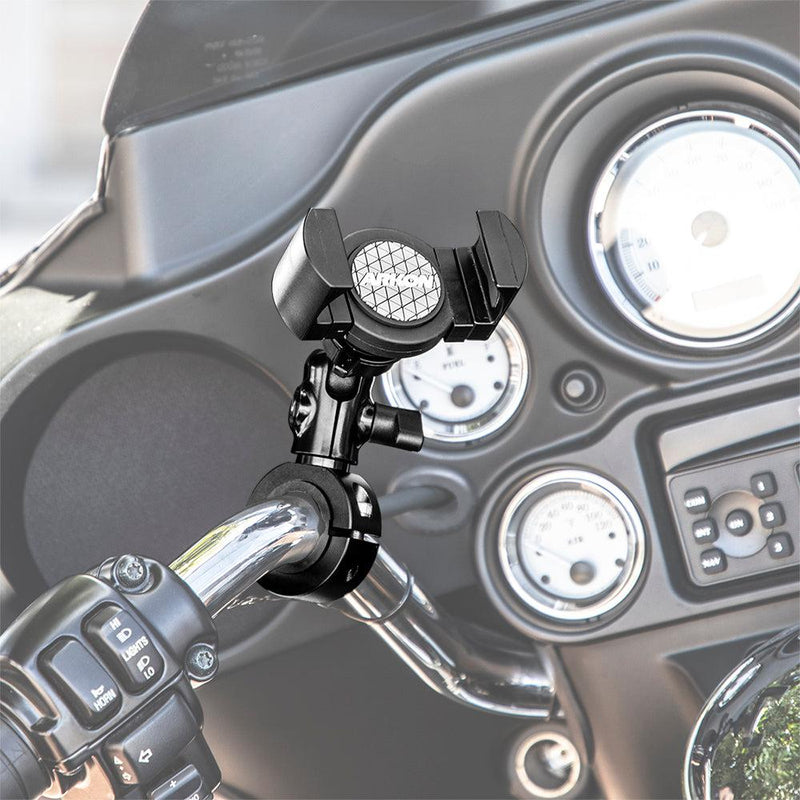 The RoadVise® XL Premium Aluminum Motorcycle Handlebar Phone and Midsize Tablet Mount is securely attached to the handlebars, with the dashboard, speedometers, and controls visible in the background.