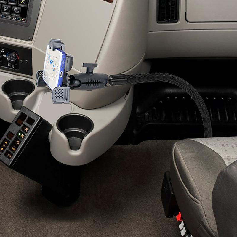 A smartphone secured on the LockVise™ Locking Seat Rail or Floor Phone Mount by the center console, displaying navigation near cup holders and control buttons.