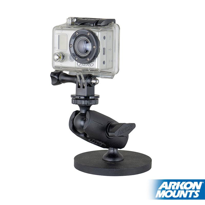 A compact GoPro action camera is mounted on the Robust Magnetic Mount for GoPro Action Cameras, featuring a black, heavy-duty round base. The Arkon Mounts logo is visible in the bottom right corner.