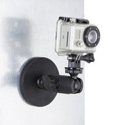 A GoPro action camera is attached to a metallic vertical surface with the Robust Magnetic Mount for GoPro Action Cameras, ensuring secure and steady footage.