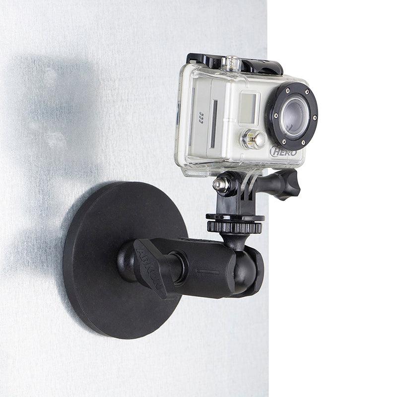 A GoPro action camera is attached to a metallic vertical surface with the Robust Magnetic Mount for GoPro Action Cameras, ensuring secure and steady footage.