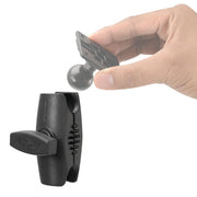 A hand holds a black mounting plate with a ball joint, ready to attach it to an ARION-labeled clamp. The adjustable clamp with ridged grip and tightening knob fits the Robust™ Series 2.75 Metal Mount Shaft—25mm (1) Ball Compatible.