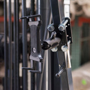 A close-up of the Slim-Grip® Tablet Holder with Forklift Front Guard Mount and 3.75 Shaft, securely fastened to gym equipment—highlighting its rugged, flexible design ideal for warehouse or forklift tablet mounting.