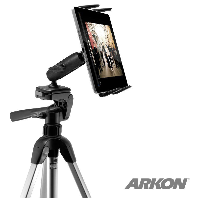 A Slim-Grip® Tripod Tablet Mount with 3.75 Shaft holds a tablet on a tripod, displaying an image of people walking indoors. The Arkon logo is visible in the lower right corner, highlighting this versatile tablet mount setup.