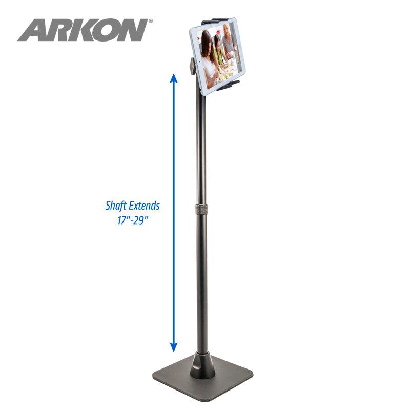 The Slim-Grip® Ultra iPad mini Desk Stand Tablet Holder features a square base and holds your tablet at the top. The shaft extends from 17 to 29 inches, as shown by a blue arrow. Perfect for live streaming, with the ARKON logo displayed in the top left corner.