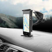 A smartphone showing a map is mounted upright on a car dashboard with the Slim-Grip® Ultra Windshield or Dash Phone Car Mount for iPad, Note, and more; mountains are blurred through the windshield.