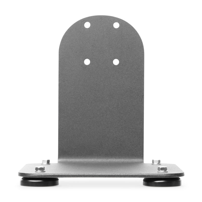 The SteadyMag™ Magnetic Mounting System is a metal L-shaped bracket with four circular holes on the vertical section, mounted on a flat base featuring two round black rubber feet and corner bolts.