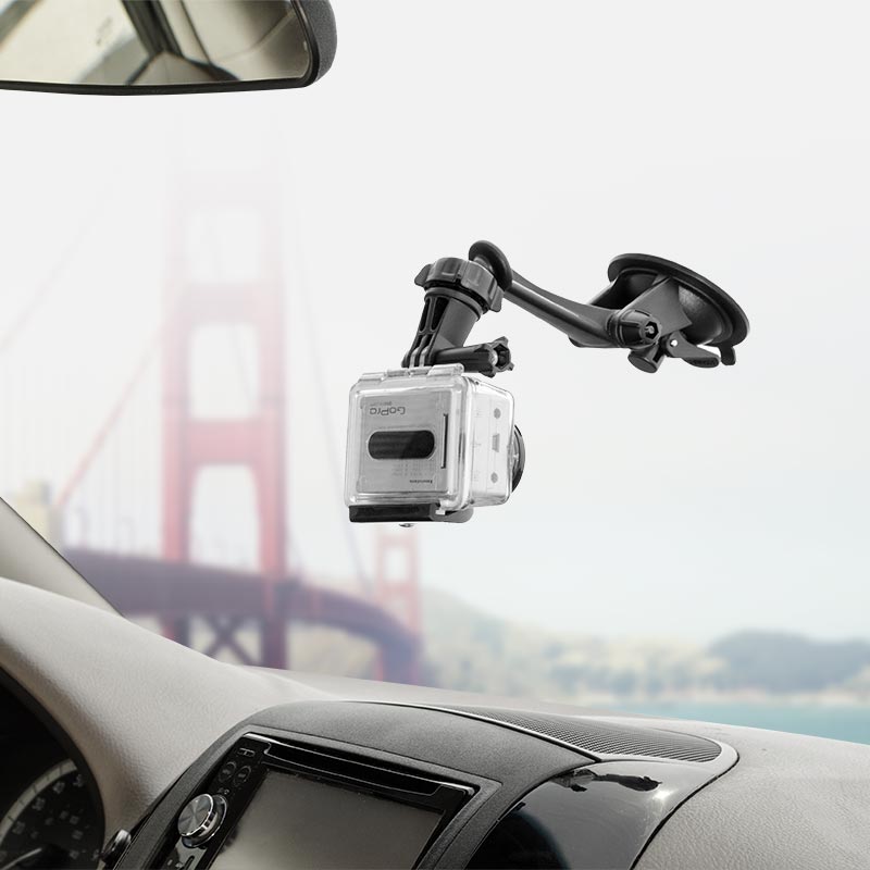 A Sticky Suction Windshield or Dash Car Mount for GoPro HERO Action Cameras secures your camera inside the car, serving as a dash cam mount with the Golden Gate Bridge visible through the front window.