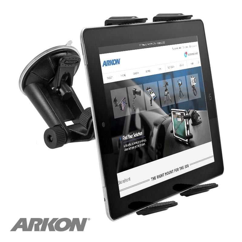 A black Windshield Suction Slim-Grip® Tablet Mount secures a tablet displaying the Arkon website, with the mount angled to show both the device and its screen. The Arkon logo appears in the lower left corner.